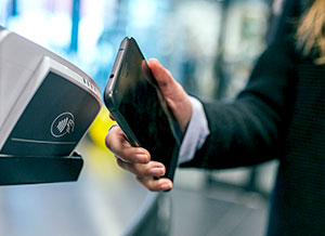 Man using contactless on a mobile phone